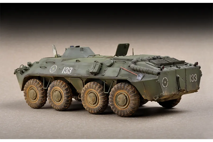 A side-rear view of a 1/72 scale plastic model of a Russian BTR-70 APC painted in olive green with the number 133 on the side and rear.