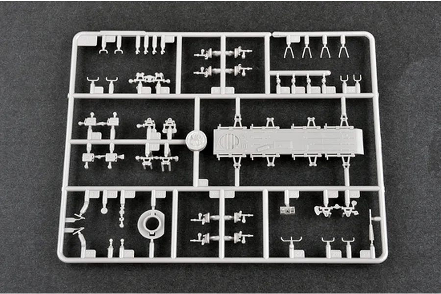 A grey plastic sprue containing various small model parts for a Trumpeter 1/72 scale BTR-70 APC model kit, viewed from above against a dark background.
