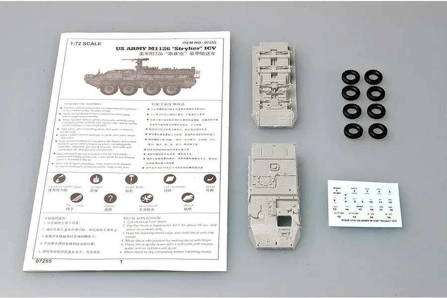 Trumpeter 1/72 scale M1126 Stryker ICV model kit parts including instruction manual, plastic hull sections, rubber tires, and a decal sheet.