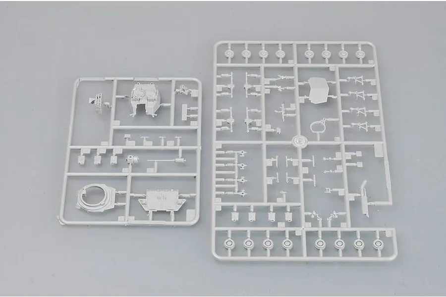 Two grey plastic model kit sprues containing various vehicle parts for a 1/72 scale military model kit.