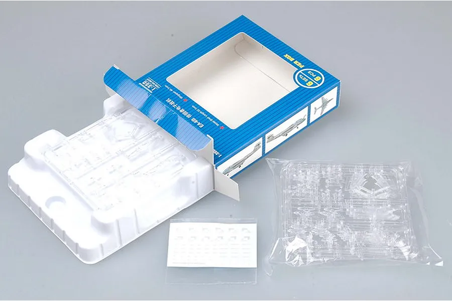 Trumpeter 1/350 scale EA-6B Prowler model kit packaging, including a blue box, clear plastic sprues in a tray, and a decal sheet.