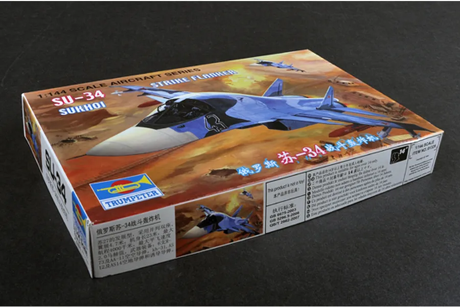 Trumpeter 1/144 scale SU-34 Strike Flanker plastic model kit box showing artwork of the aircraft in flight over a desert landscape.