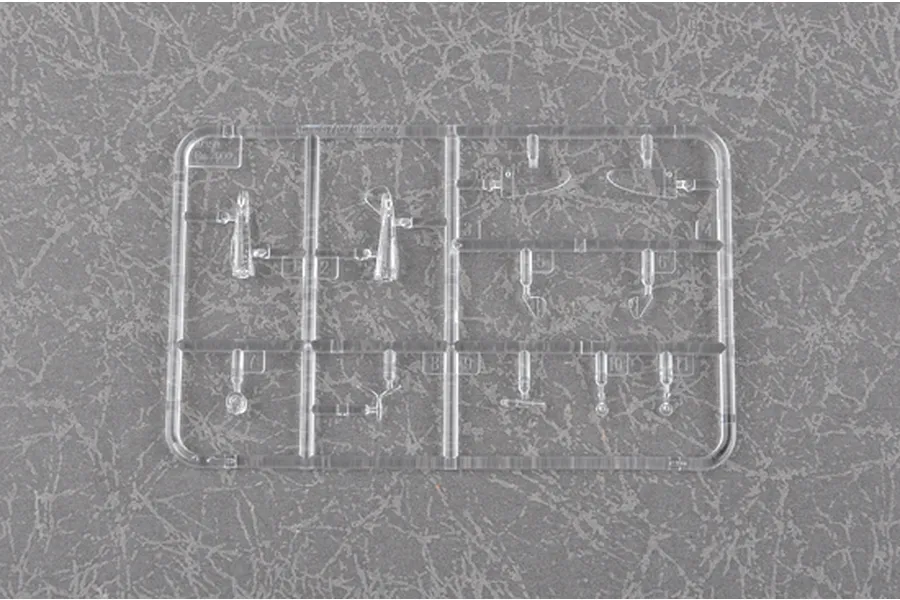 A clear plastic sprue containing small model aircraft parts for a 1/350 scale Re.2000 model kit, set against a grey textured background.
