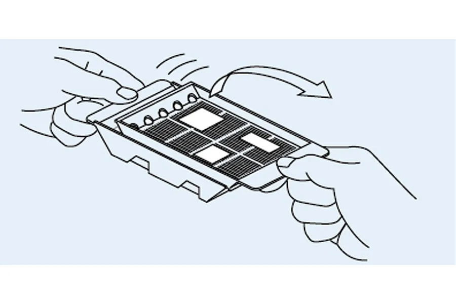 A line drawing illustration showing two hands holding a modeler's decal tray, demonstrating how to insert or remove the inner tray.