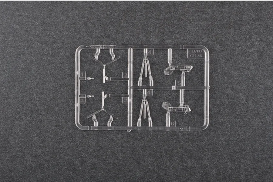 A clear plastic sprue containing small parts for a 1/700 scale CH-46 Sea Knight helicopter model kit on a dark grey background.