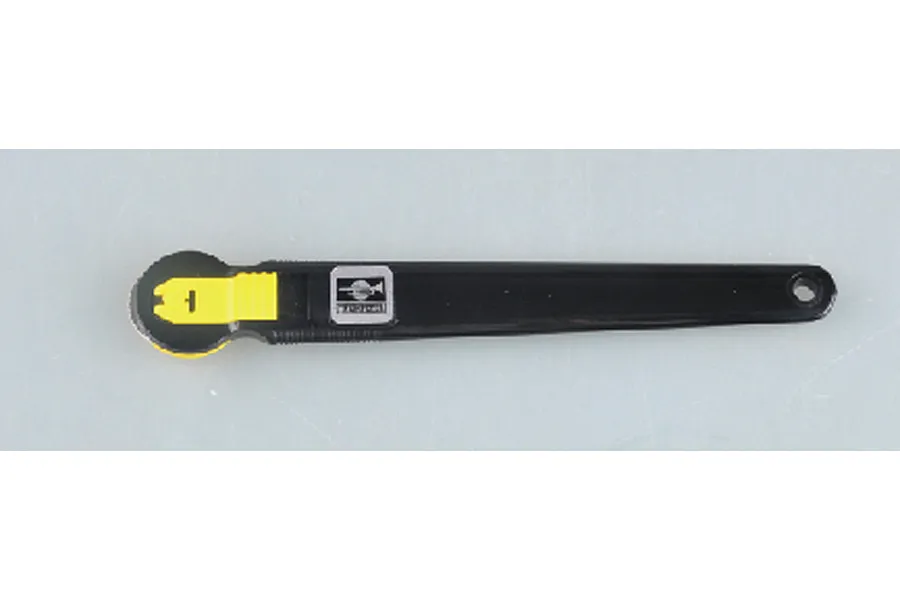 A Trumpeter Master Tools rivet maker tool with a black handle and yellow blade attachment, shown against a plain light grey background.
