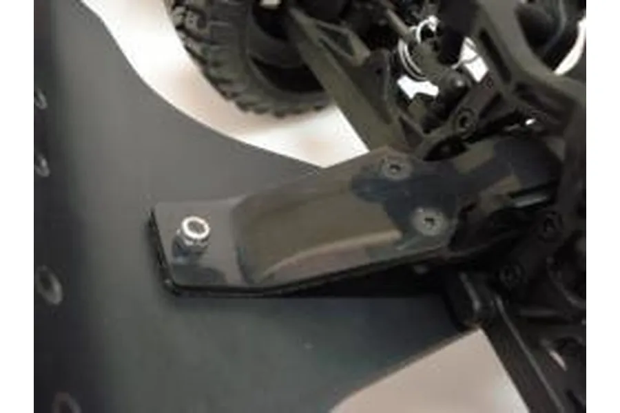 Close-up of a black T-Bone Racing front basher bumper installed on an HPI Blitz RC truck chassis.