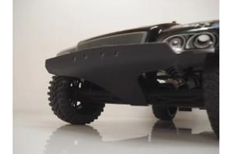 A close-up low angle shot of a black T-Bone Racing front basher bumper installed on an HPI Blitz RC short course truck.