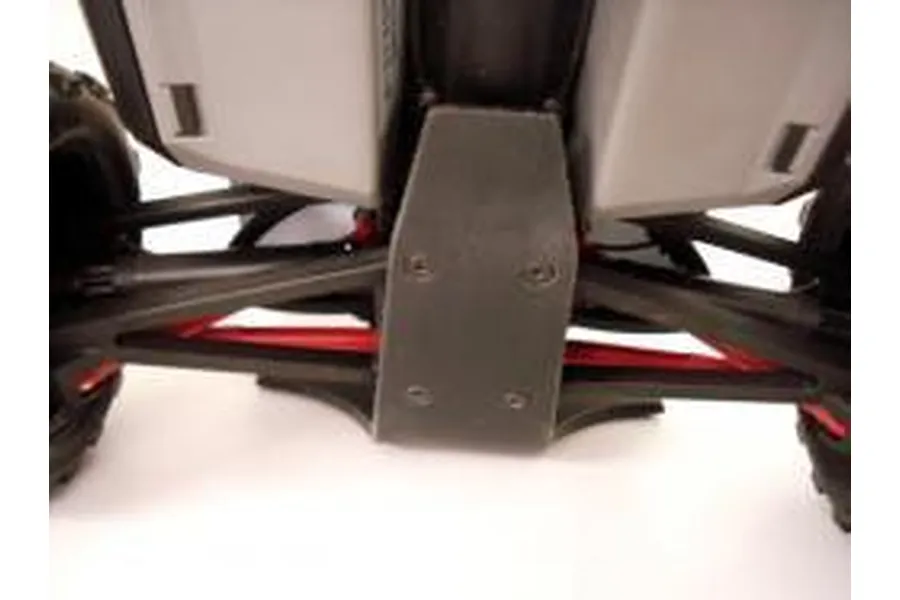 A close-up view of a black T-Bone Racing rear bumper installed on a Traxxas 1/16 E-Revo RC vehicle chassis.