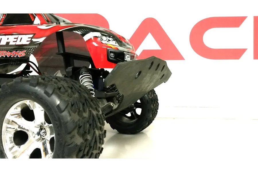 A close-up view of a T-Bone Racing wide front bumper installed on a red Traxxas Stampede RC truck.