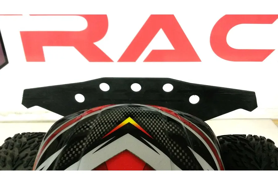 A black T-Bone Racing wide front bumper installed on a Traxxas Stampede RC truck, viewed from the front.