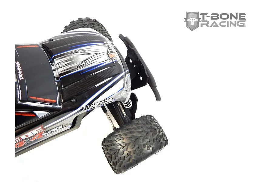 A close-up view of a Traxxas Stampede 4x4 RC truck featuring a T-Bone Racing front bumper installed on the chassis.