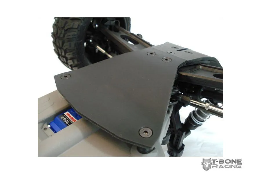 T-Bone Racing black servo guard installed on a Traxxas Stampede 4x4 RC vehicle chassis.