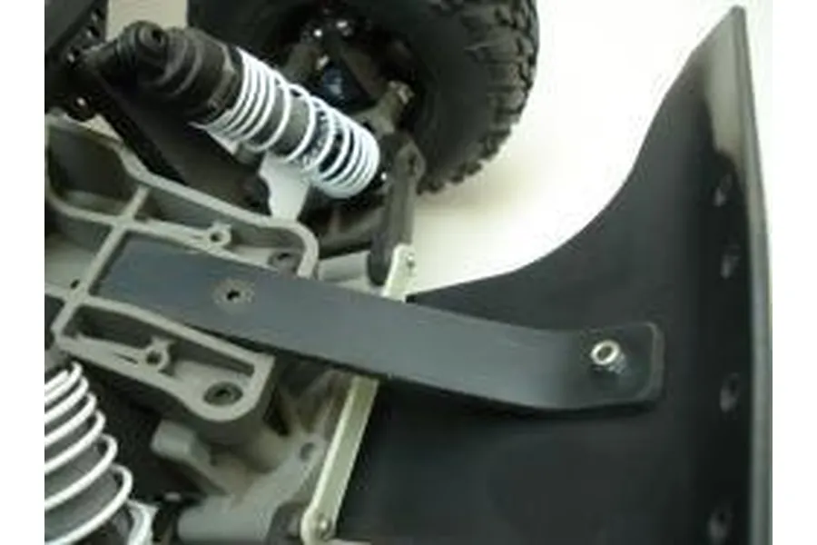 Close-up of a T-Bone Racing black nylon skid plate installed on the front of an RC vehicle chassis.