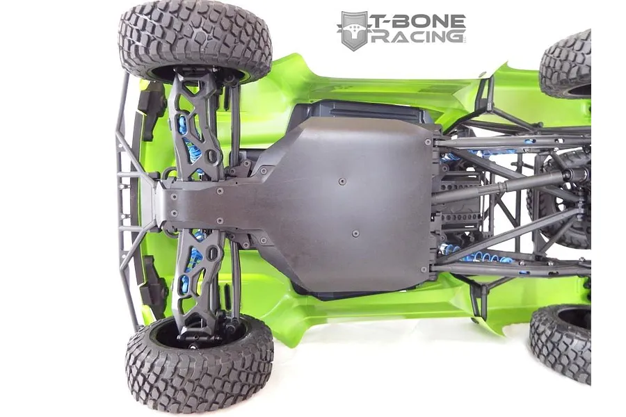 Bottom view of an Axial Yeti Score Trophy RC truck showing the installed T-Bone Racing black skid plate.