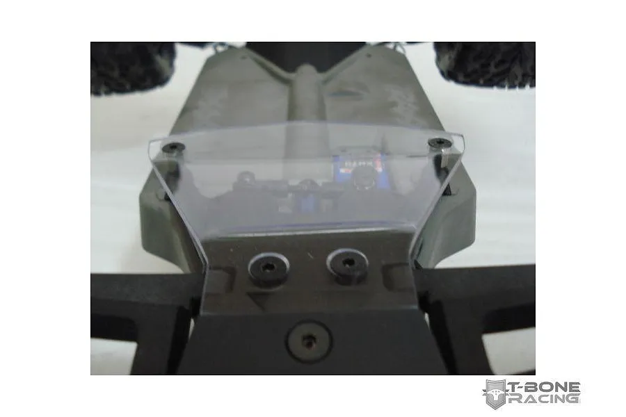 A clear T-Bone Racing servo guard installed on a Traxxas Stampede 4x4 RC chassis, viewed from the front.