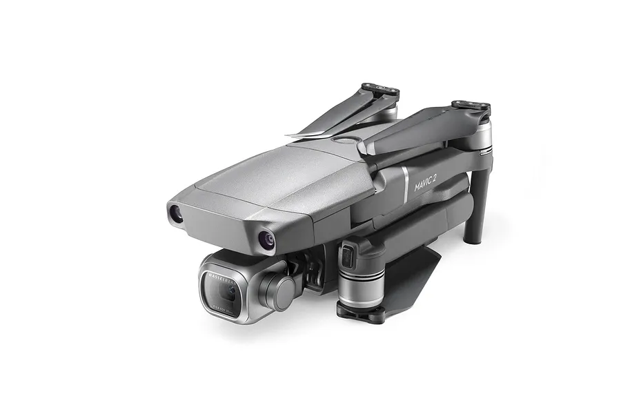 A folded DJI Mavic 2 Pro drone in grey, featuring a Hasselblad camera gimbal, isolated on a white background.