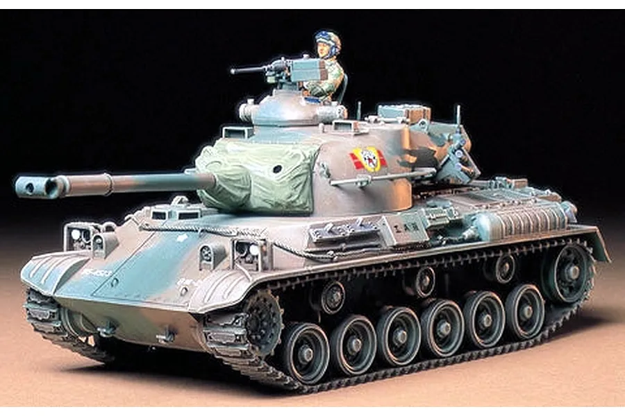 A fully assembled and painted 1/35 scale Tamiya Japanese Type 61 tank model kit with a crew figure in the turret.