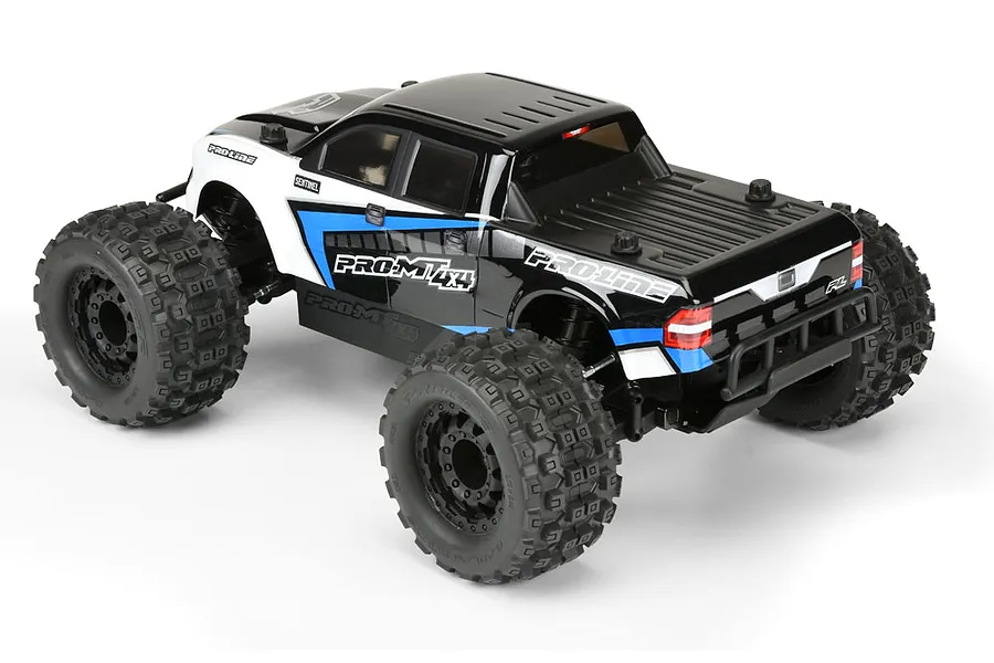 Pro-Line PRO-MT 4x4 RC monster truck roller with black and white body, large knobby tires, and blue accents on a white background.
