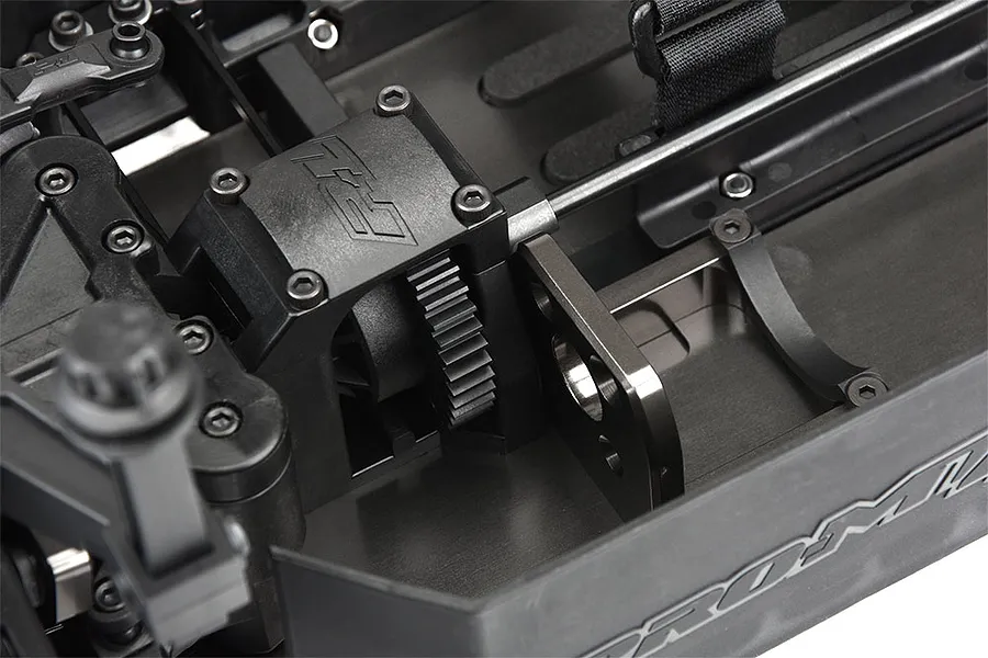 Close-up of the internal chassis and motor mount area of a Pro-Line PRO-MT RC monster truck roller.