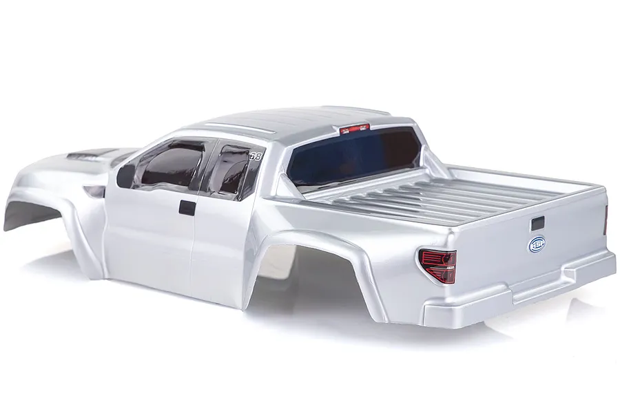 A silver pre-painted RC short course truck body shell by HSP, viewed from the rear three-quarter angle against a white background.