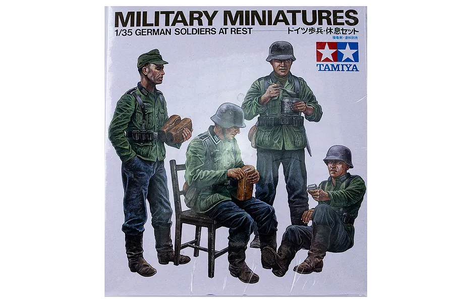 Tamiya 1/35 scale German Soldiers at Rest plastic model kit box art featuring four soldiers in various resting poses.