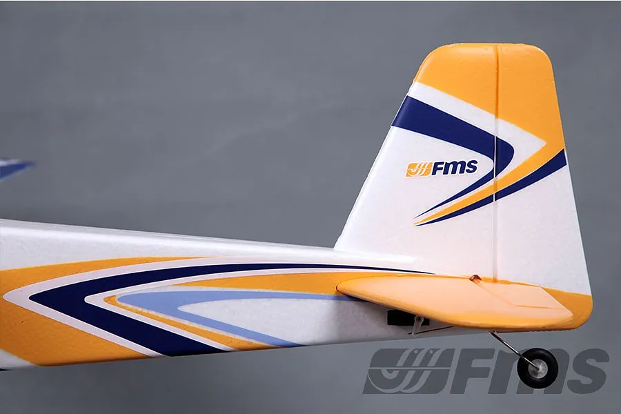 Close-up of the tail section of an FMS Super Ez V3 RC plane, showing the vertical stabilizer, rudder, and horizontal stabilizer with yellow and blue decals.