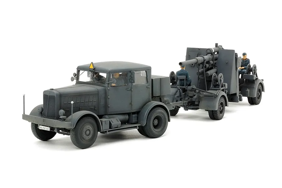 A 1/48 scale model of a German SS-100 heavy truck towing an 88mm Flak 37 anti-aircraft gun with crew figures, set against a white background.