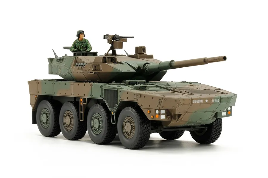 A fully assembled and painted 1/48 scale Tamiya JGSDF Type 16 Combat Vehicle model kit on a white background.