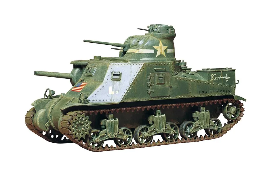 A fully assembled and painted Tamiya 1/35 scale M3 Lee medium tank model, featuring olive drab paint, a white star, and the name Kentucky on the side.