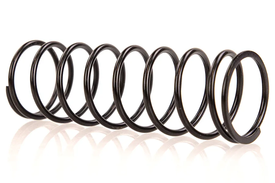 A single black metal coil spring for an RC car shock absorber, shown against a white background.