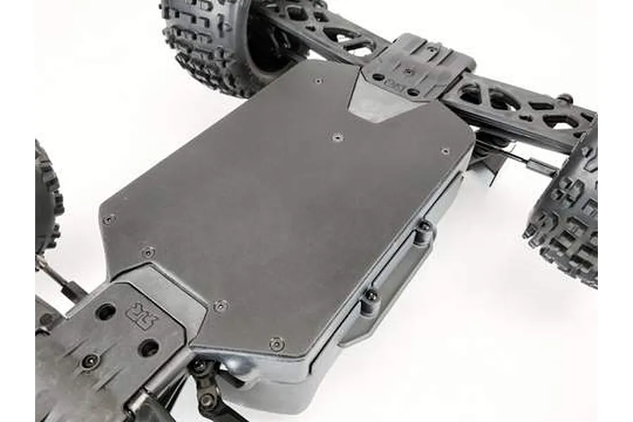Bottom view of an ARRMA RC vehicle chassis with a T-Bone Racing skid plate installed.