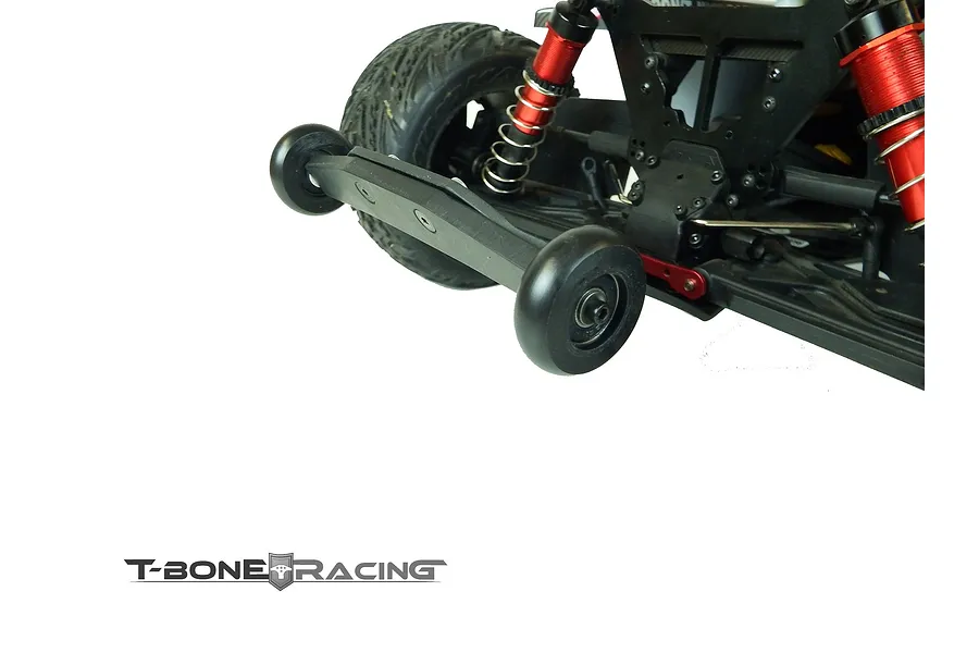 T-Bone Racing wheelie bar installed on the rear of an ARRMA Kraton RC truck, showing black plastic construction and two wheels.