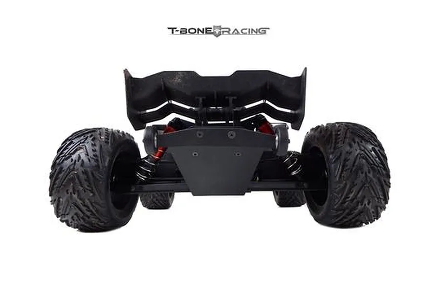 Rear view of an ARRMA Kraton RC truck equipped with a black T-Bone Racing wheelie bar, showing the rear tires, wing, and suspension components.