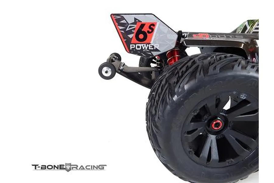 A close-up view of the rear section of an ARRMA Kraton RC truck featuring a T-Bone Racing wheelie bar installed.