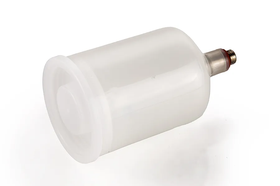 A translucent white plastic airbrush paint cup with a metal threaded connector, isolated on a white background.
