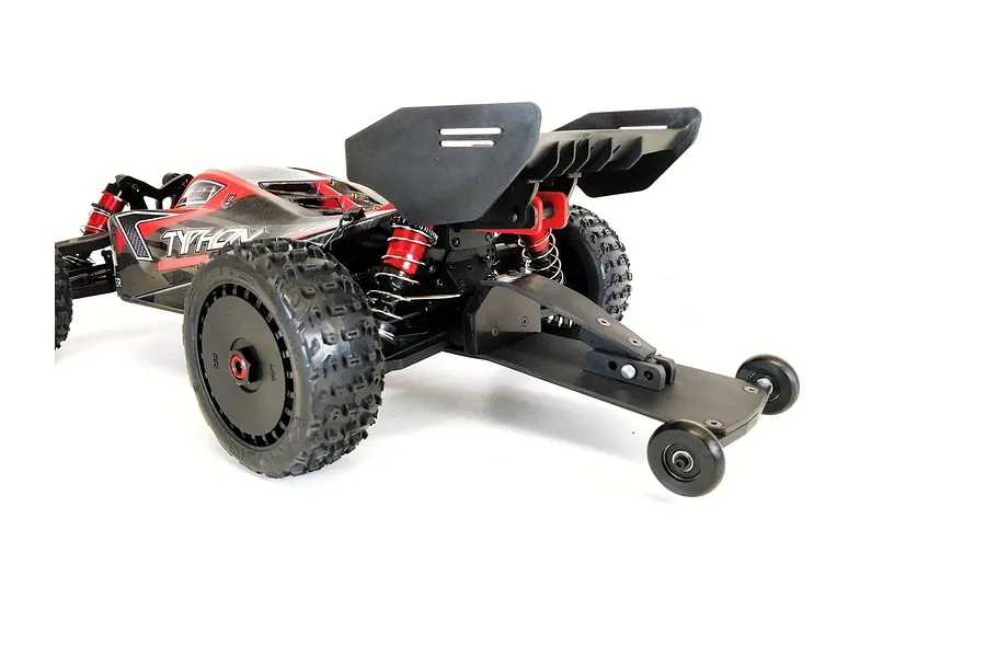 A black T-Bone Racing wheelie bar installed on the rear of an ARRMA Typhon RC buggy against a white background.