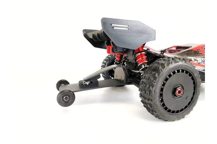 T-Bone Racing wheelie bar installed on the rear of an ARRMA Typhon RC buggy, showing the black plastic bar and small wheels.