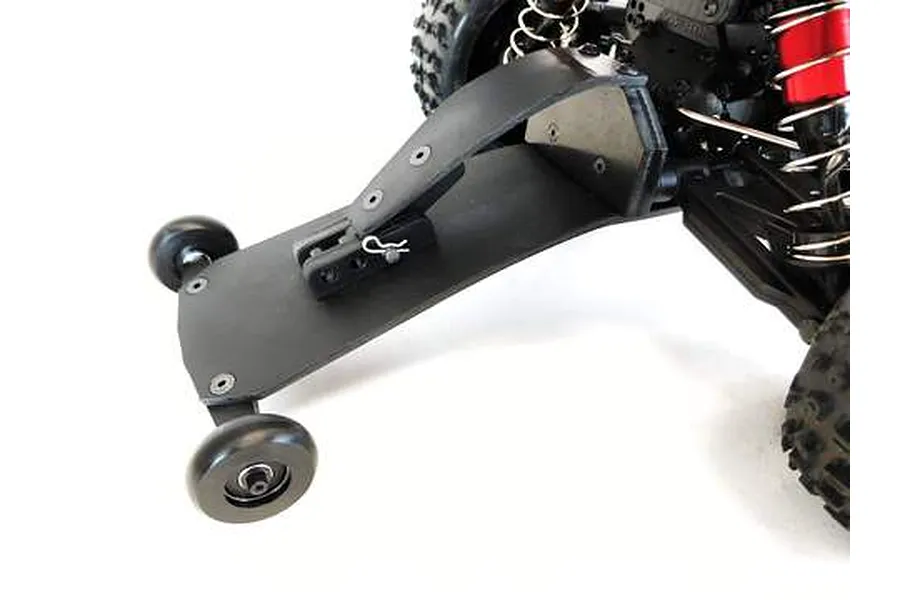 T-Bone Racing high speed wheelie bar installed on the rear of an ARRMA Typhon RC buggy, featuring a black plastic skid plate and two small wheels.