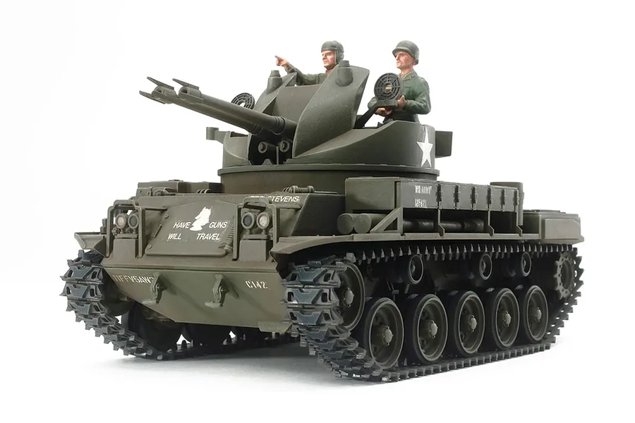 A fully assembled and painted 1/35 scale Tamiya M42 Duster anti-aircraft tank model with two crew figures, set against a plain white background.