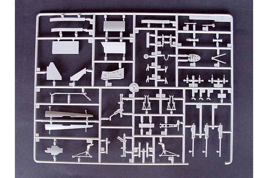 A grey plastic sprue containing various unpainted model aircraft parts for a 1/32 scale Vought F4U-4 Corsair model kit.