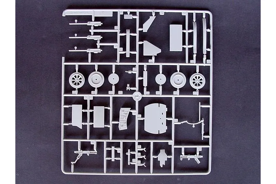 A grey plastic sprue containing various unpainted model aircraft parts for a Trumpeter 1/32 Vought F4U-4 Corsair kit.