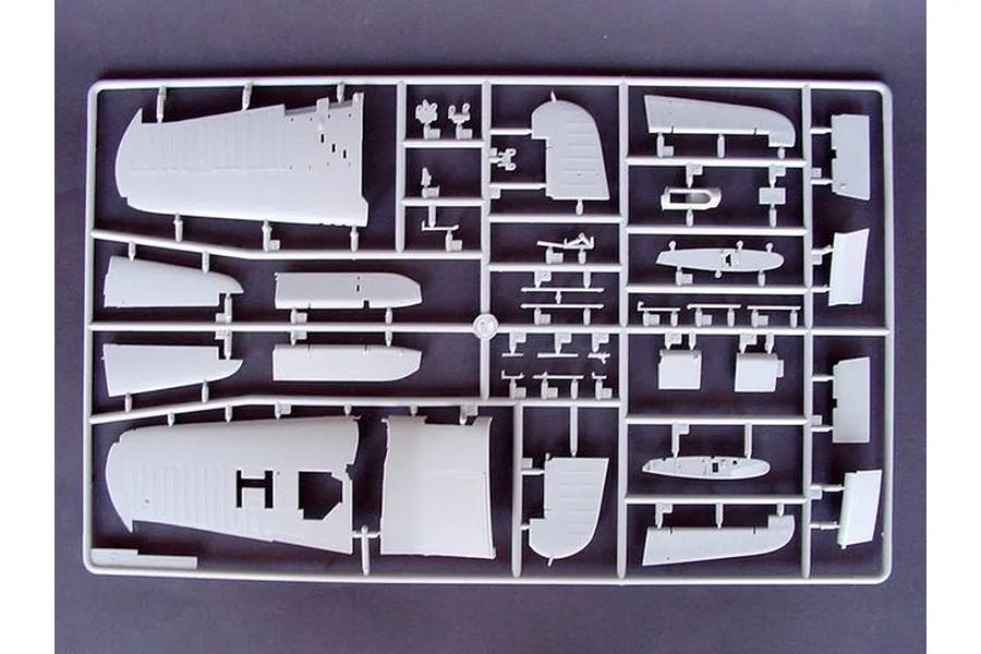 A grey plastic model kit sprue containing various aircraft wing and fuselage parts for a 1/32 scale model.