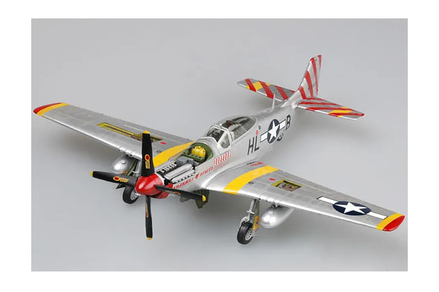 A completed 1/32 scale plastic model kit of a P-51D Mustang fighter plane, featuring a silver finish with red and yellow markings.