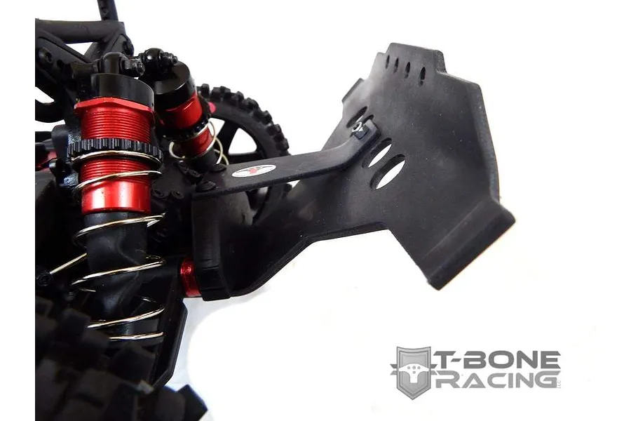 A close-up view of a black T-Bone Racing front bumper installed on an ARRMA RC vehicle, showing the shock absorbers and chassis details.