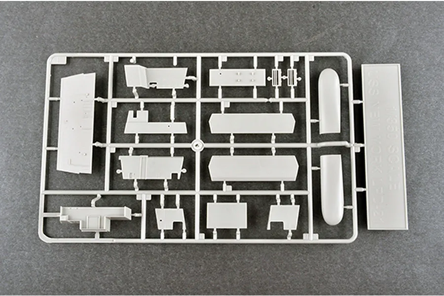 A grey plastic sprue containing various model ship parts for a 1/350 scale USS New York LPD-21 model kit.
