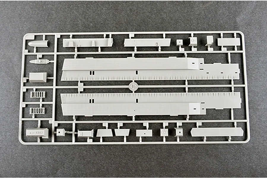 A grey plastic sprue containing various model ship parts for a 1/350 scale USS New York LPD-21 model kit.