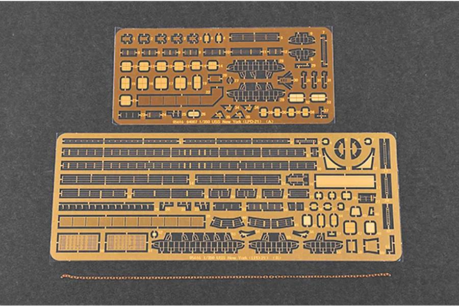 Two photo-etched brass detail sheets and a length of metal chain for a 1/350 scale USS New York model kit.