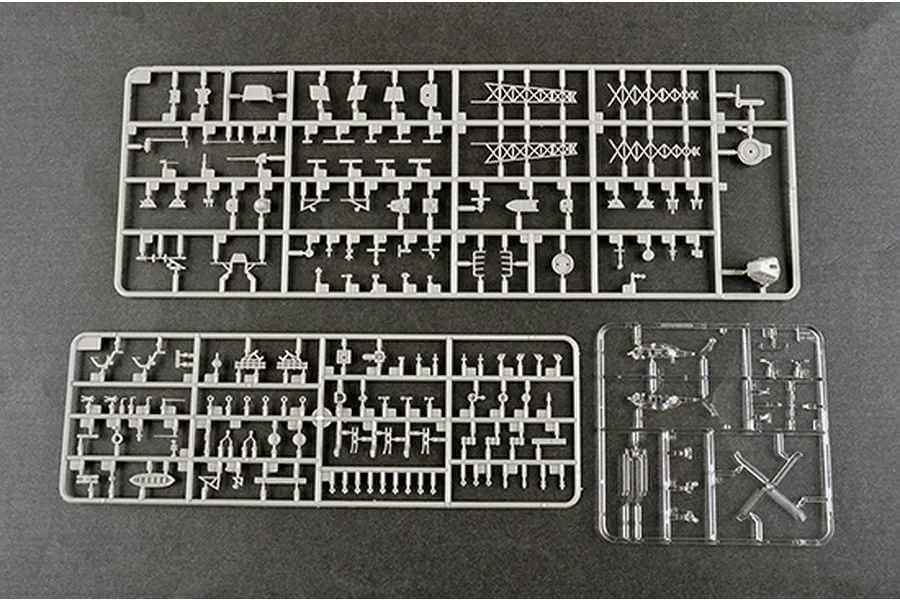 Three plastic model kit sprues for a 1/350 scale ship model, including two grey plastic sprues and one clear plastic sprue on a dark grey background.