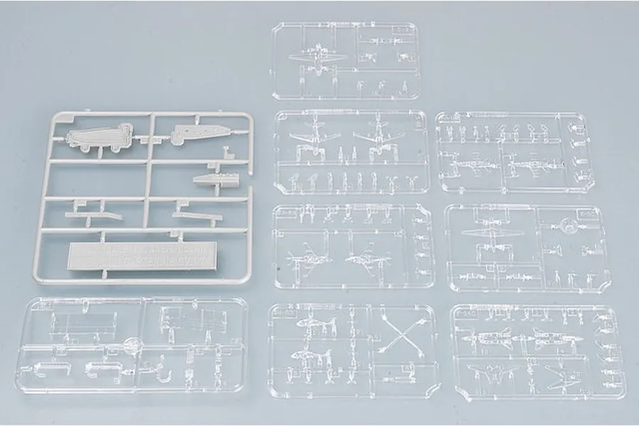 Several plastic model kit sprues for the Trumpeter 1/700 USS John C. Stennis CVN-74, including one grey sprue and multiple clear plastic aircraft sprues.